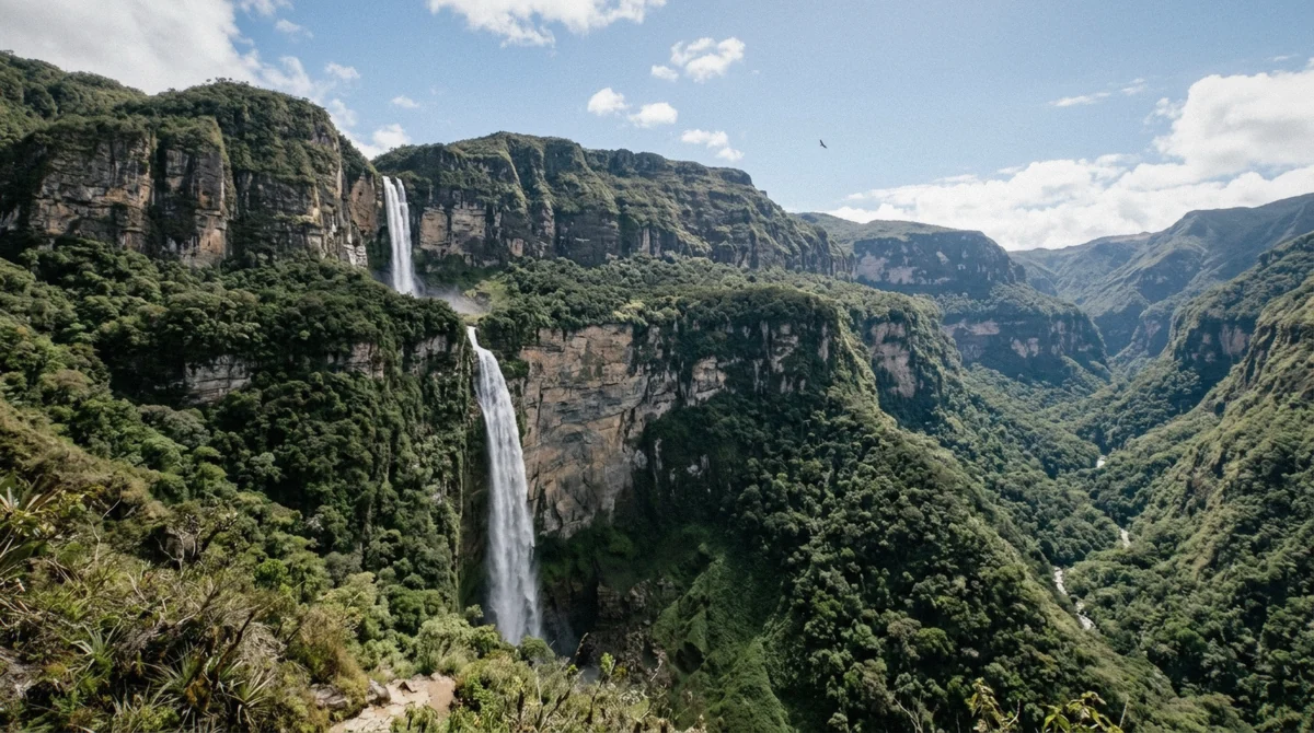 Both tiers of the 771-metre Gocta waterfall visible together from a cloud-forest viewpoint, showing the true height of Gocta waterfall in Amazonas, Peru
